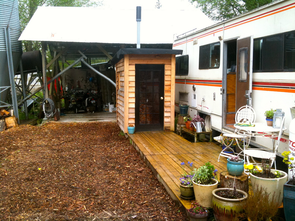 Provided a pretty deck hang-out space that looked like this and even housed my cedar-shed-composting-toilet!...